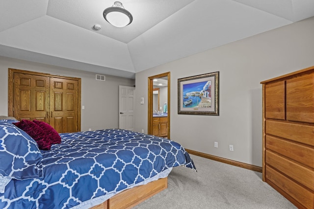 carpeted bedroom featuring visible vents and baseboards