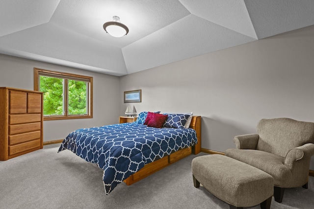 bedroom featuring baseboards, vaulted ceiling, and carpet floors