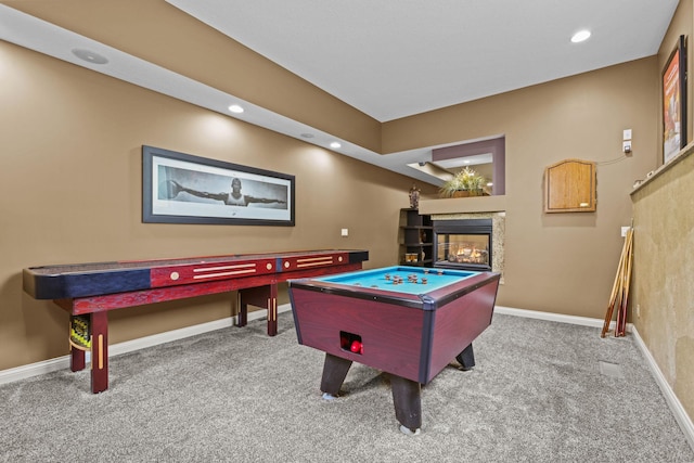 rec room with carpet, baseboards, and a multi sided fireplace