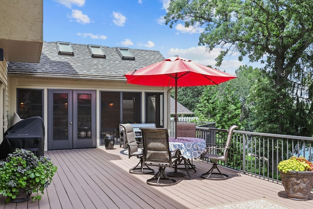 deck featuring outdoor dining area