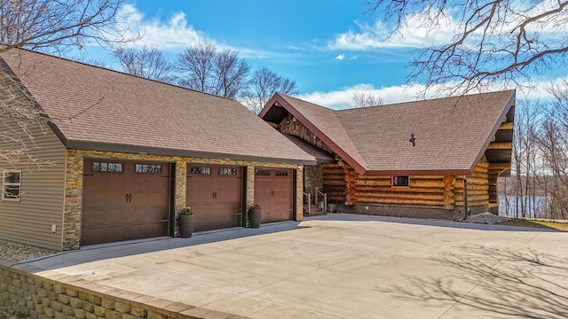 46174 County Highway 35, Vergas, MN 56587 - view of front of property with log exterior, stone siding, a garage, driveway, and roof with shingles