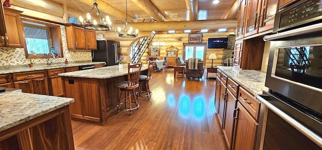 46174 County Highway 35, Vergas, MN 56587 - kitchen with black appliances, wood ceiling, dark wood finished floors, a sink, and brown cabinets