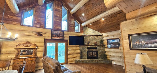 46174 County Highway 35, Vergas, MN 56587 - living area featuring hardwood / wood-style floors, wooden ceiling, beamed ceiling, high vaulted ceiling, and a stone fireplace