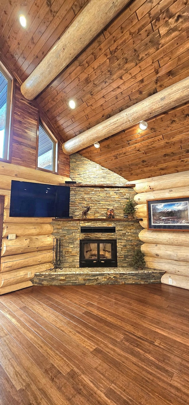 46174 County Highway 35, Vergas, MN 56587 - unfurnished living room featuring wooden ceiling, hardwood / wood-style floors, a fireplace, rustic walls, and recessed lighting