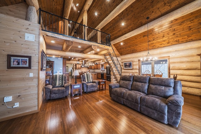 46174 County Highway 35, Vergas, MN 56587 - living room with stairs, high vaulted ceiling, rustic walls, wood-type flooring, and a chandelier