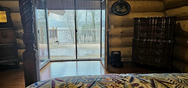 46174 County Highway 35, Vergas, MN 56587 - bedroom featuring hardwood / wood-style floors, access to outside, and multiple windows