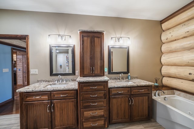 46174 County Highway 35, Vergas, MN 56587 - bathroom with a bath, double vanity, and wood finished floors