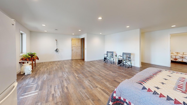 46174 County Highway 35, Vergas, MN 56587 - bedroom with freestanding refrigerator, wood finished floors, recessed lighting, and baseboards