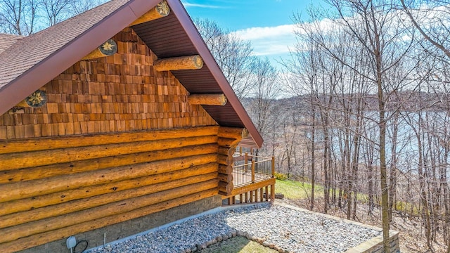 46174 County Highway 35, Vergas, MN 56587 - view of home's exterior featuring roof with shingles, log exterior, and a deck