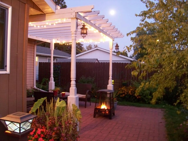 1211 Diagonal Rd, Worthington, MN 56187 - view of patio / terrace with a fire pit and a pergola