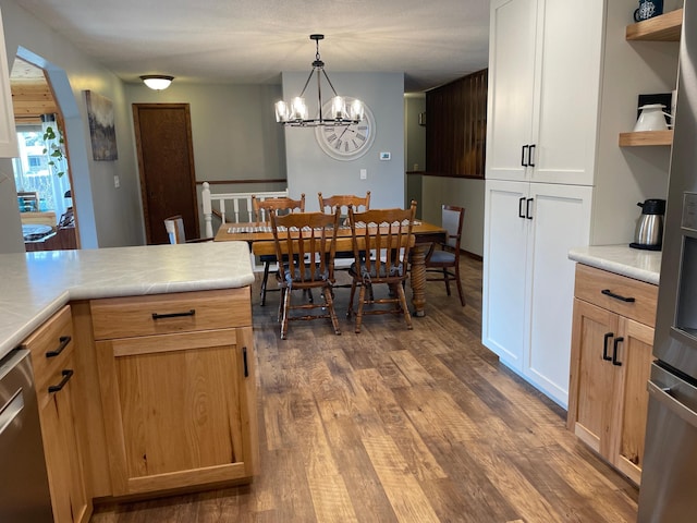 1211 Diagonal Rd, Worthington, MN 56187 - dining space with wood finished floors and a chandelier