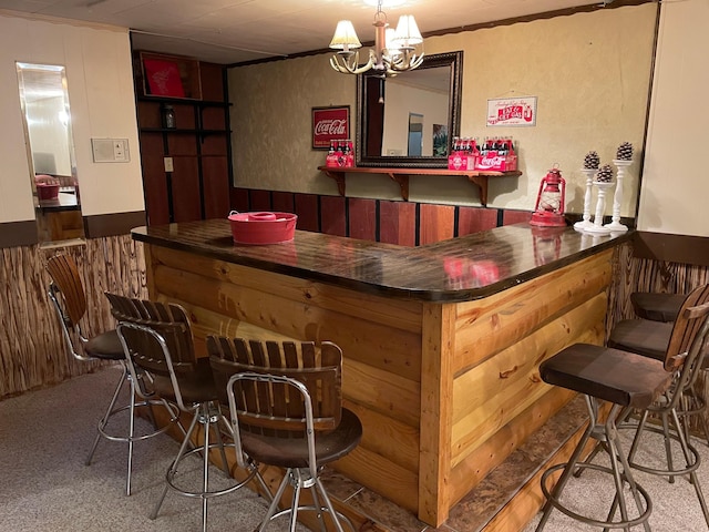 1211 Diagonal Rd, Worthington, MN 56187 - indoor dry bar featuring carpet flooring and a chandelier