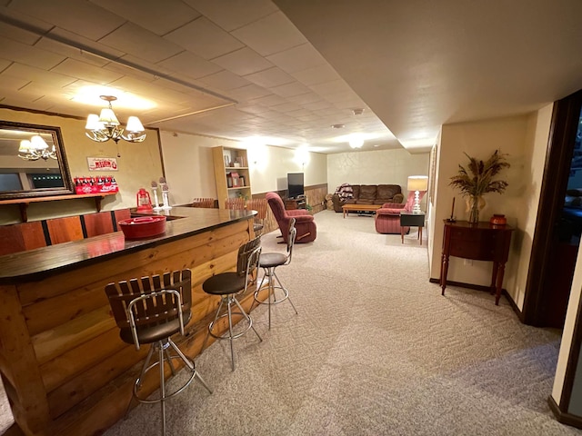1211 Diagonal Rd, Worthington, MN 56187 - indoor dry bar featuring carpet floors and a chandelier