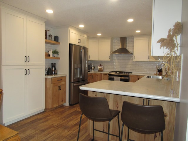 1211 Diagonal Rd, Worthington, MN 56187 - kitchen featuring wall chimney range hood, appliances with stainless steel finishes, a sink, backsplash, and open shelves