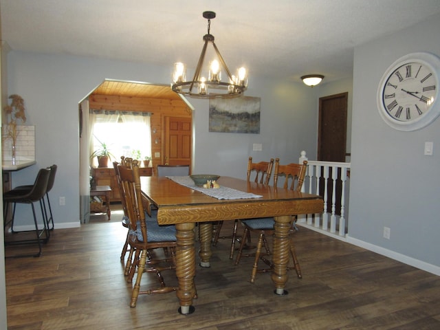 1211 Diagonal Rd, Worthington, MN 56187 - dining area with dark wood finished floors, a chandelier, and baseboards
