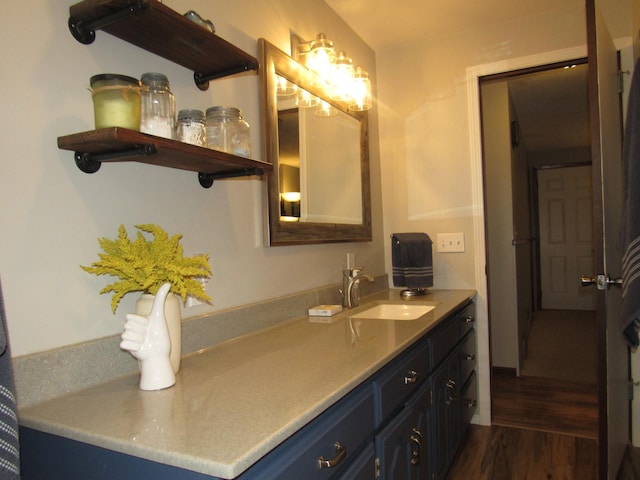 1211 Diagonal Rd, Worthington, MN 56187 - bathroom featuring wood finished floors and vanity