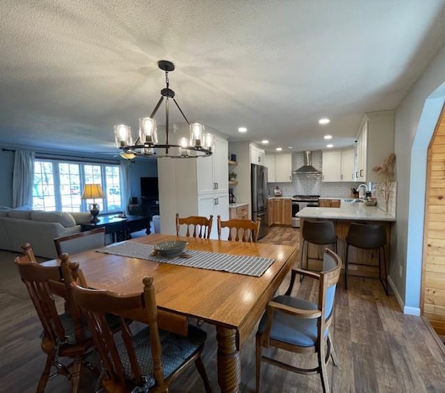 1211 Diagonal Rd, Worthington, MN 56187 - dining space with a chandelier, dark wood-style flooring, and recessed lighting