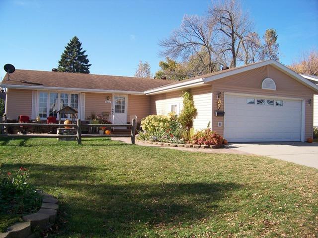 1211 Diagonal Rd, Worthington, MN 56187 - ranch-style house with a garage, a front yard, and driveway