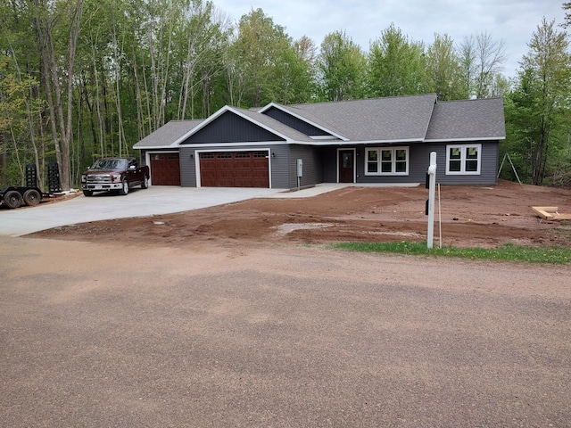 24888 65th Ave, Sigel Twp, WI 54727 - ranch-style home with a garage, concrete driveway, and roof with shingles