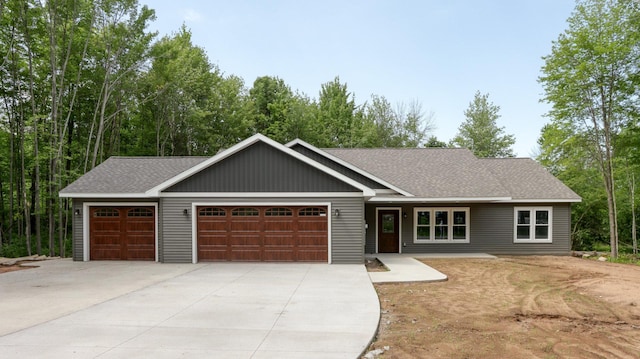 24888 65th Ave, Sigel Twp, WI 54727 - view of front facade with a garage, driveway, and roof with shingles