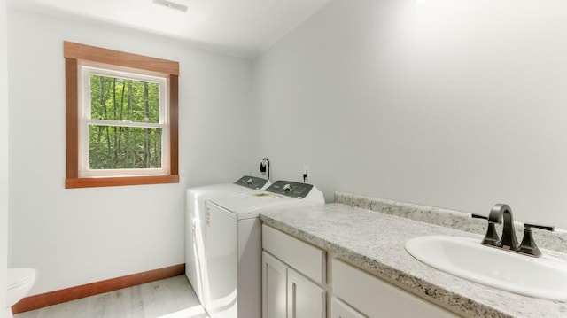 24888 65th Ave, Sigel Twp, WI 54727 - laundry room featuring washing machine and dryer and light wood finished floors
