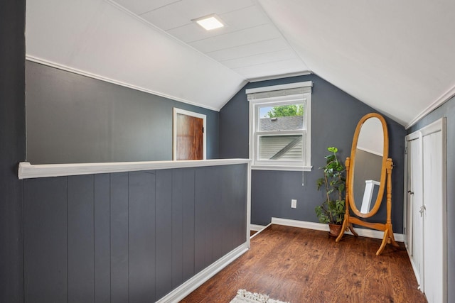 3011 Brunswick Ave S, Saint Louis Park, MN 55416 - hallway featuring wood finished floors, vaulted ceiling, and baseboards