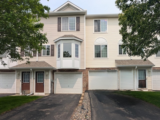 16150 71st Ln NE, Otsego, MN 55330 - townhome / multi-family property featuring driveway and an attached garage