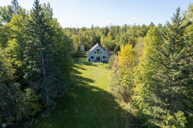 drone / aerial view featuring a view of trees