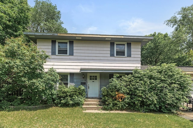 7716 Orchard Ave N, Brooklyn Park, MN 55443 - view of front facade with a front lawn