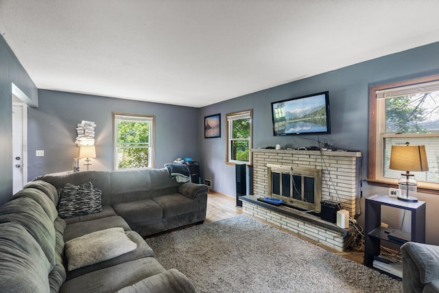 7716 Orchard Ave N, Brooklyn Park, MN 55443 - living area featuring wood finished floors and a fireplace