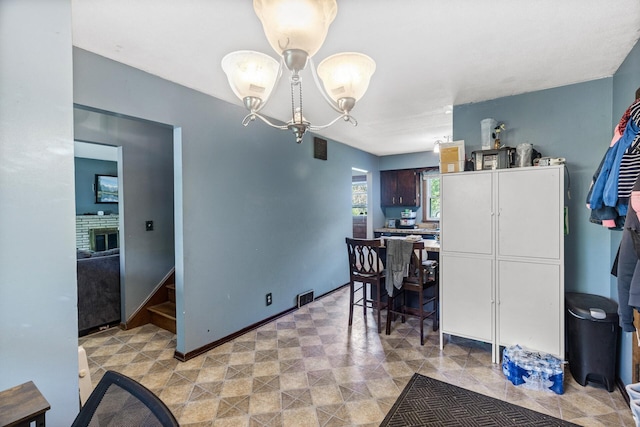 7716 Orchard Ave N, Brooklyn Park, MN 55443 - dining area featuring a chandelier