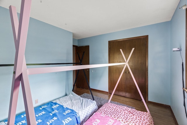7716 Orchard Ave N, Brooklyn Park, MN 55443 - bedroom featuring wood finished floors and baseboards