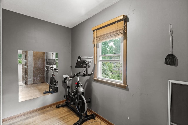 7716 Orchard Ave N, Brooklyn Park, MN 55443 - workout area with wood finished floors and baseboards