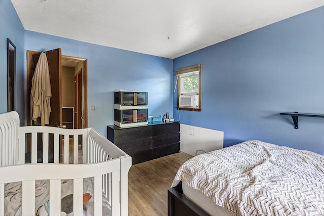 7716 Orchard Ave N, Brooklyn Park, MN 55443 - bedroom with wood finished floors and cooling unit