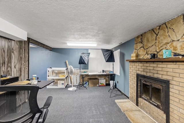 7716 Orchard Ave N, Brooklyn Park, MN 55443 - office featuring a textured ceiling, carpet flooring, and a fireplace