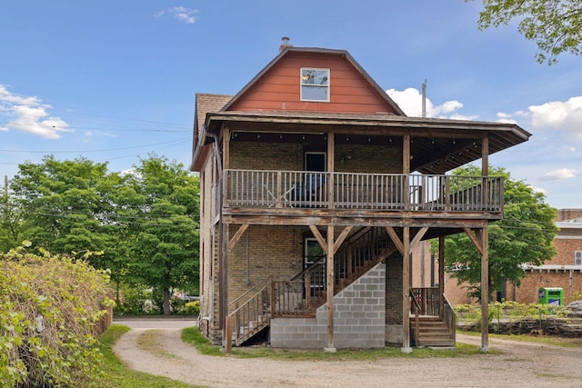1208 University Ave NE, Minneapolis, MN 55413 - view of front facade with stairway, brick siding, and a deck