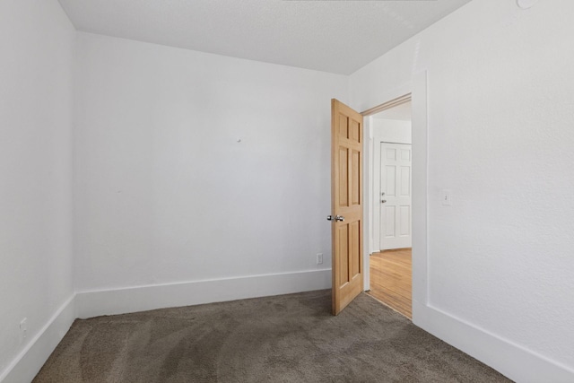 1208 University Ave NE, Minneapolis, MN 55413 - unfurnished room with dark carpet and baseboards