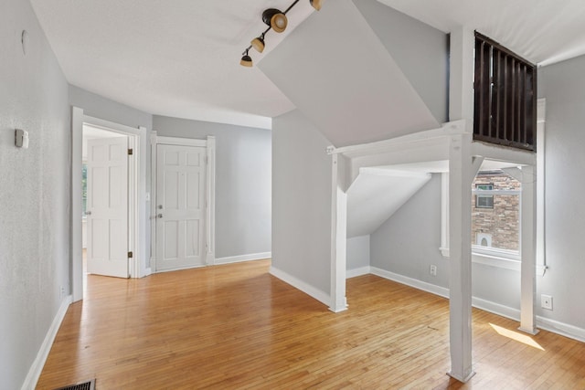 1208 University Ave NE, Minneapolis, MN 55413 - additional living space featuring light wood-style flooring and baseboards