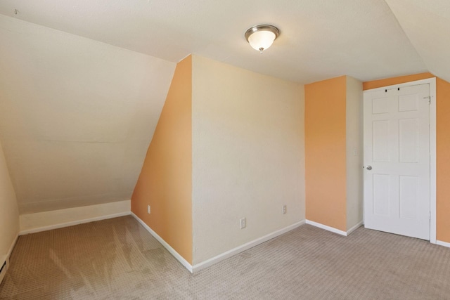 1208 University Ave NE, Minneapolis, MN 55413 - bonus room with light carpet, baseboards, vaulted ceiling, and a baseboard heating unit