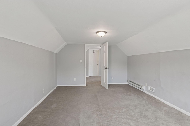 1208 University Ave NE, Minneapolis, MN 55413 - additional living space featuring a baseboard heating unit, lofted ceiling, carpet flooring, and baseboards