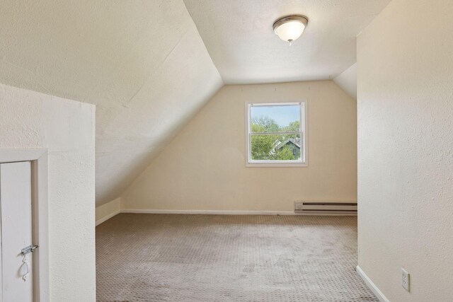 1208 University Ave NE, Minneapolis, MN 55413 - bonus room with baseboard heating, carpet floors, vaulted ceiling, and baseboards