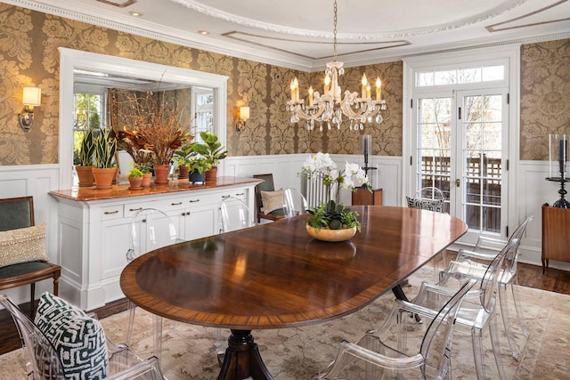 2774 Lake Of The Isles Pkwy, Minneapolis, MN 55416 - dining room with wallpapered walls, a wainscoted wall, a decorative wall, a chandelier, and ornamental molding