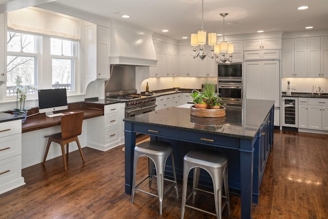 2774 Lake Of The Isles Pkwy, Minneapolis, MN 55416 - kitchen with beverage cooler, appliances with stainless steel finishes, a center island, white cabinetry, and a breakfast bar area