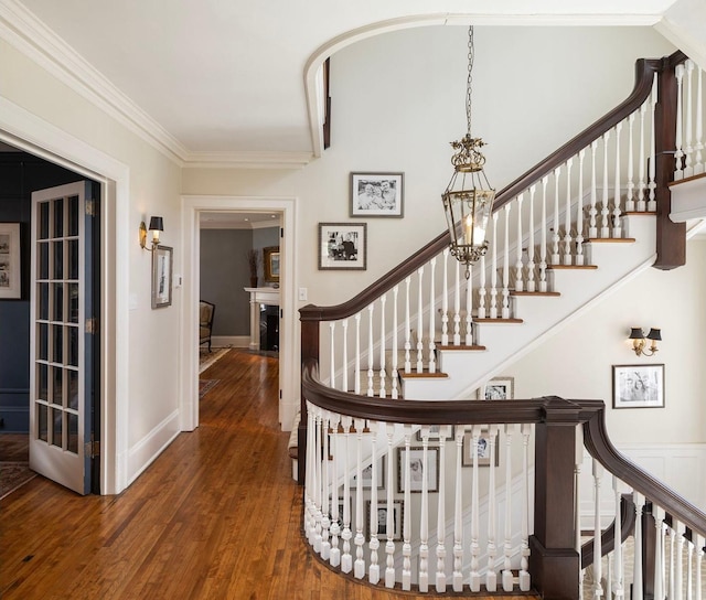2774 Lake Of The Isles Pkwy, Minneapolis, MN 55416 - stairway featuring wood finished floors and crown molding