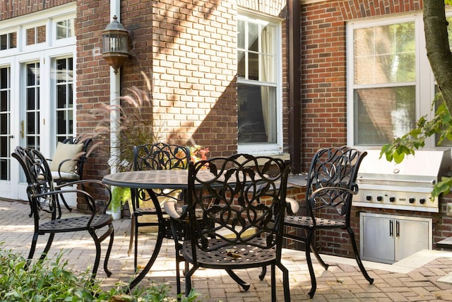 2774 Lake Of The Isles Pkwy, Minneapolis, MN 55416 - view of patio / terrace with french doors, outdoor dining area, and a grill