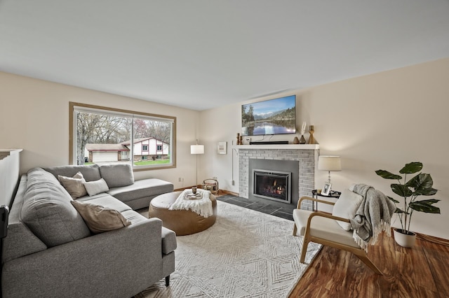 living area featuring a fireplace and wood finished floors