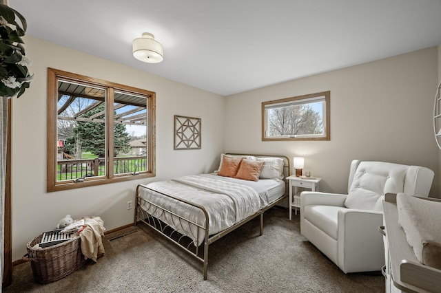 bedroom with visible vents and carpet