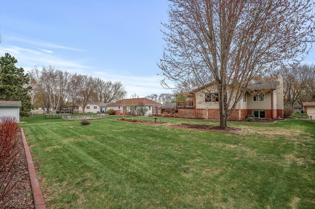 view of yard with a fire pit
