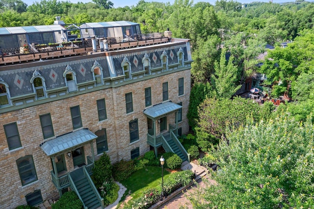 14 Grove St Unit 14A, Minneapolis, MN 55401 - view of property with stairs and a forest view