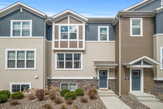 multi unit property featuring board and batten siding and stone siding
